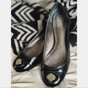 Black Patent Leather Coach Flats with Metal Logo